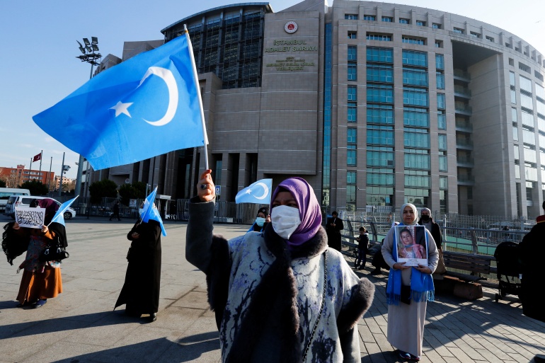 Uighurs in Turkey file criminal case against Chinese officials An ethnic Uighur woman waves the flag of East Turkestan outside of the courthouse in Istanbul Turkey