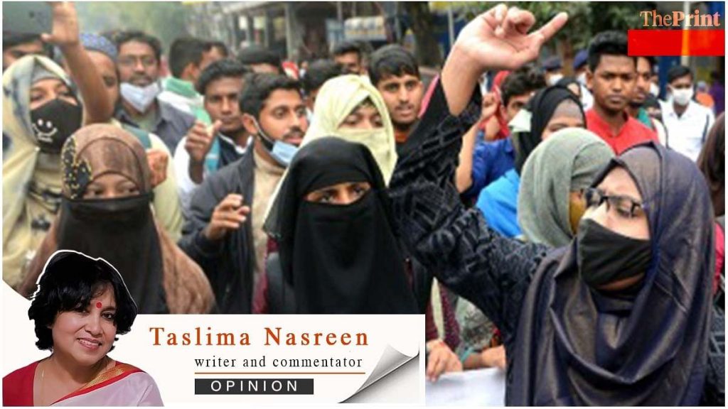 Muslim women must see burqa is just like chastity belt of dark ages, Taslima Nasreen writes Students take out a protest rally from Aliah University in Kolkata against the hijab ban imposed by few Karnataka colleges